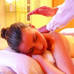 female client is taking full body therapy in massage center Faisalabad