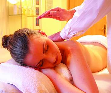 female client is taking back therapy ing glory massage center Faisalabad